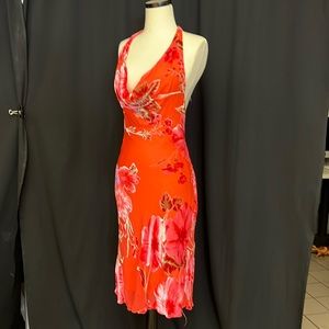 Bright colorful cocktail dress. Low front, open back.